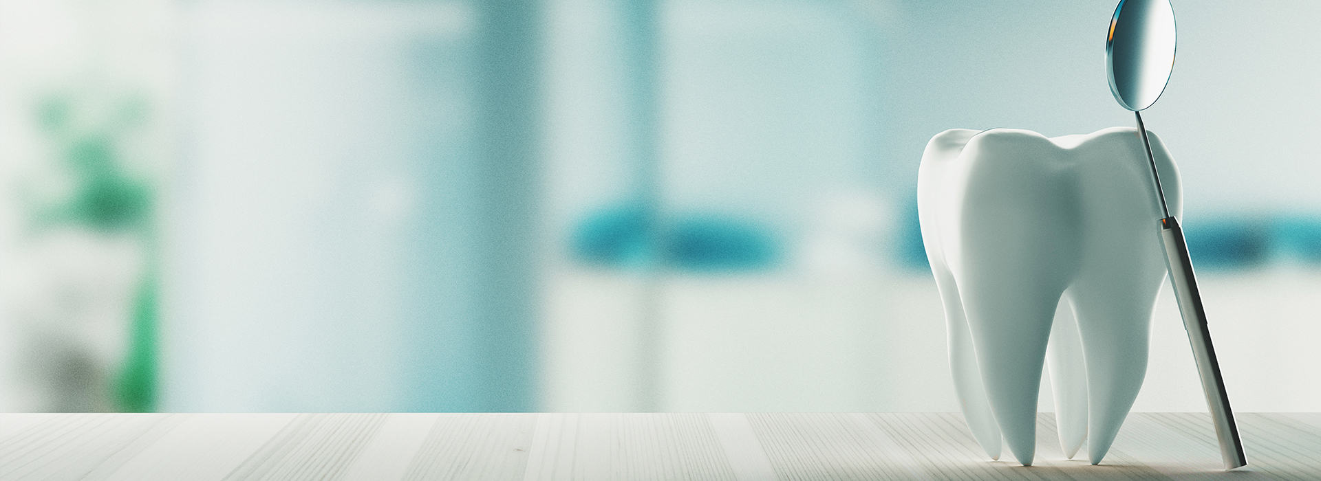 The image shows a toothbrush with bristles placed on a surface, possibly in a dental or healthcare setting, with a blurred background that suggests an indoor environment.